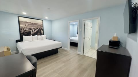 Suite, 2 Bedrooms | Desk, soundproofing, iron/ironing board, free WiFi
