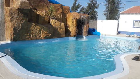 Outdoor pool, open 8:00 AM to midnight, sun loungers