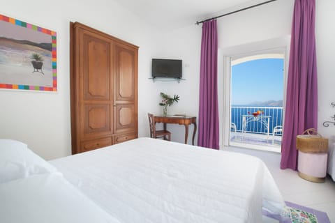 Standard Triple Room, Sea View | Minibar, in-room safe, individually furnished, desk