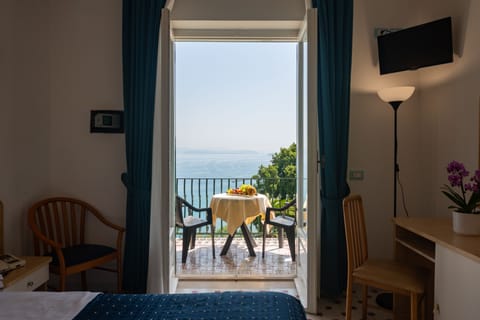 Superior Double Room, Balcony, Sea View | Minibar, in-room safe, desk, travel crib