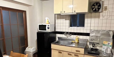 Apartment 502 Tsukuyomi | Private kitchen | Fridge, microwave, stovetop, coffee/tea maker