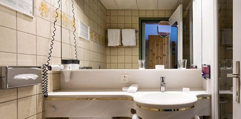 Shower, free toiletries, hair dryer, slippers