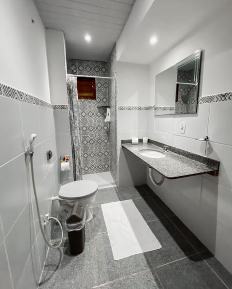 Family Triple Room | Bathroom | Shower, free toiletries, hair dryer, towels