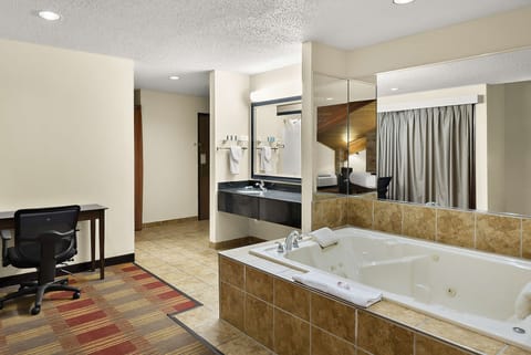 Suite, 1 King Bed, Non Smoking, Pool View (Jetted tub) | In-room safe, desk, laptop workspace, iron/ironing board