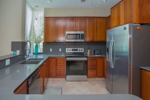 Condo, 2 Bedrooms | Private kitchen | Fridge, oven, stovetop, coffee/tea maker