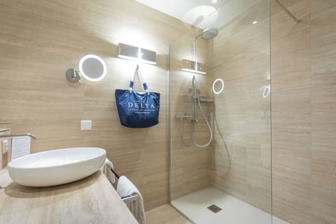 Shower, rainfall showerhead, designer toiletries, hair dryer