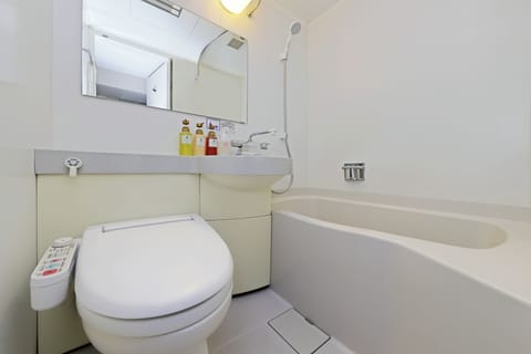 Combined shower/tub, free toiletries, hair dryer, slippers