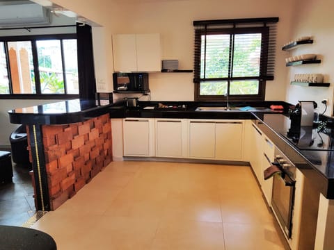 Luxury Villa | Private kitchen | Full-size fridge, microwave, stovetop, electric kettle