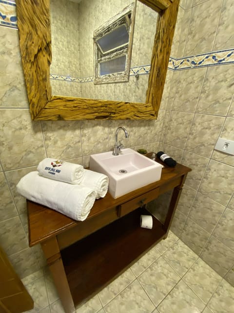 Deluxe Studio | Bathroom | Shower, towels, soap, toilet paper