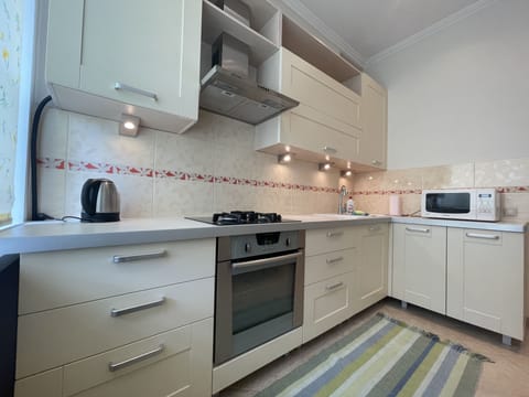 Classic Apartment, 2 Bedrooms | Private kitchen | Full-size fridge, microwave, oven, stovetop