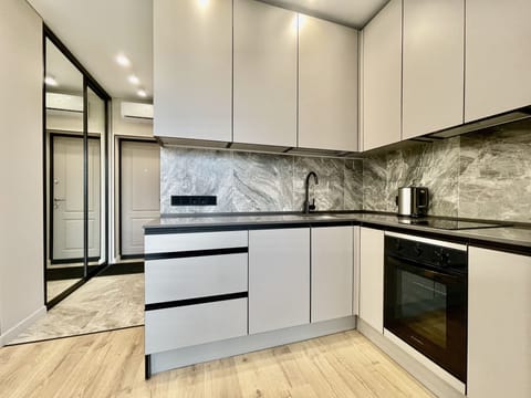 Comfort Apartment | Private kitchen | Full-size fridge, microwave, oven, stovetop