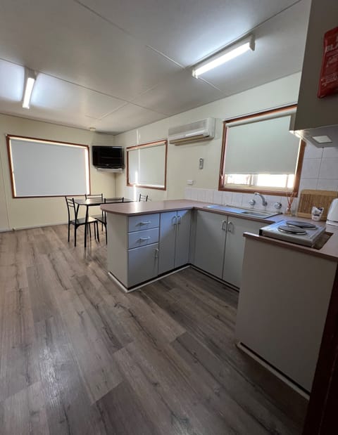 Deluxe Cabin | Private kitchen | Full-size fridge, microwave, stovetop, toaster