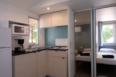 Premium Mobile Home, 3 Bedrooms | Private kitchenette | Full-size fridge, stovetop, cookware/dishes/utensils, dining tables