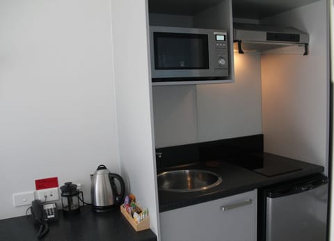 Kitchenette Studio | Private kitchenette | Microwave, coffee/tea maker, electric kettle, toaster