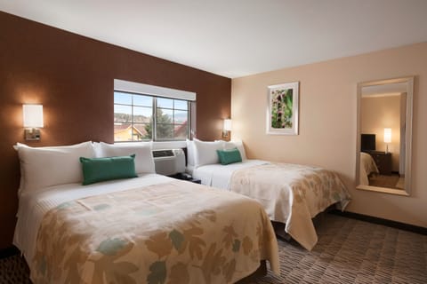 Premium bedding, pillowtop beds, desk, laptop workspace