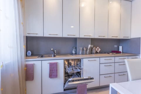 Apartment, 1 Bedroom | Private kitchenette | Full-size fridge, microwave, stovetop, dishwasher
