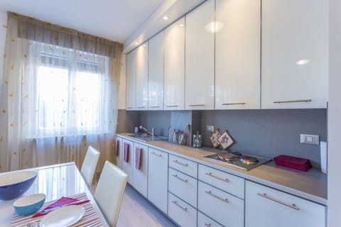 Apartment, 1 Bedroom | Private kitchenette | Full-size fridge, microwave, stovetop, dishwasher
