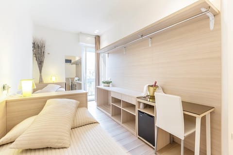 Classic Twin Room | Minibar, desk, laptop workspace, blackout drapes