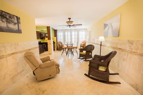 Luxury Suite | Living area | 22-inch flat-screen TV with cable channels, TV