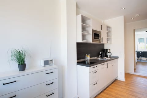 Apartment, 1 Bedroom | Private kitchen | Shared fridge