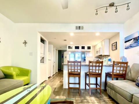 Condo, 1 Bedroom, Balcony (204A) | Living area | Flat-screen TV