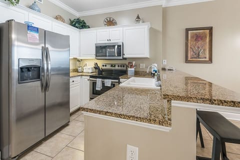 Condo, 2 Bedrooms, Balcony, Beachfront (1002) | Private kitchen | Full-size fridge, microwave, oven, stovetop