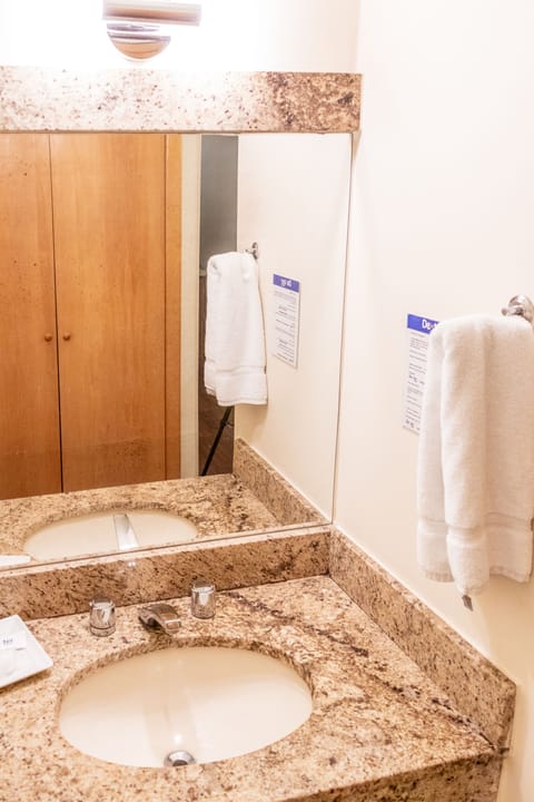 Shower, rainfall showerhead, hair dryer, towels