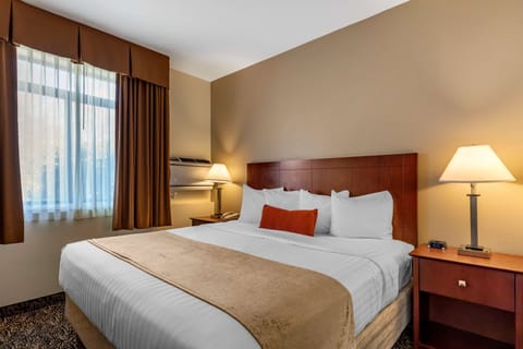 Suite, 1 King Bed, Non Smoking, Refrigerator & Microwave | Desk, laptop workspace, blackout drapes, iron/ironing board