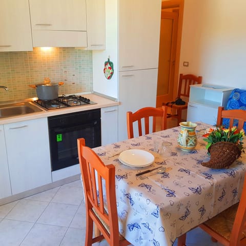 Apartment, 1 Bedroom (Bilocali Savonarola) | Private kitchen | Full-size fridge, oven, stovetop, cookware/dishes/utensils