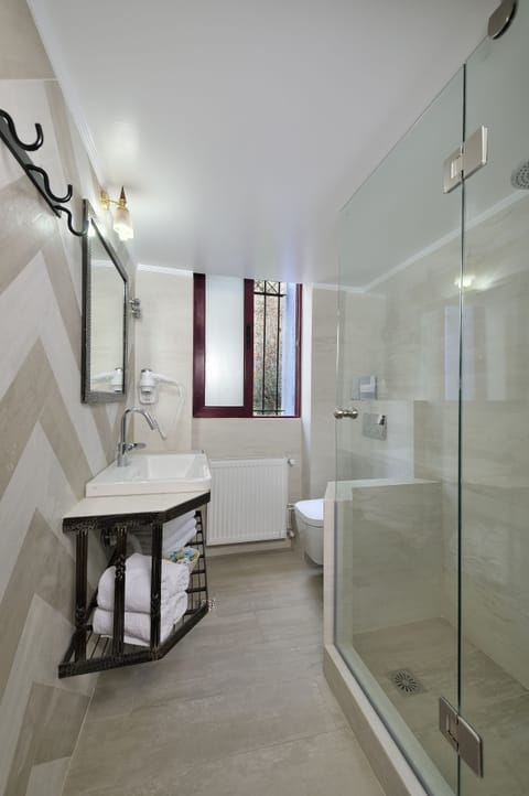 Standard Quadruple Room, Balcony | Bathroom | Shower, free toiletries, hair dryer, towels