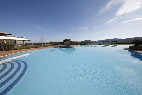 Indoor pool, seasonal outdoor pool, pool umbrellas, sun loungers