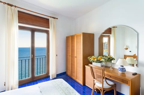 Triple Room, Sea View | Minibar, in-room safe, desk