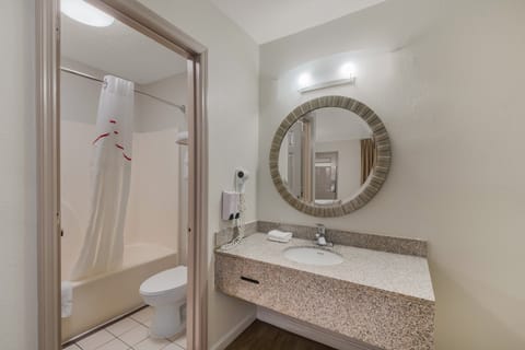 Superior Room, 1 King Bed, Non Smoking | Bathroom | Combined shower/tub, hair dryer, towels