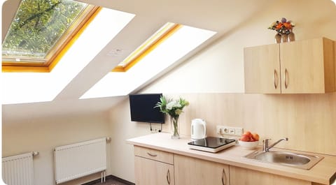 Superior Room with Kitchenette | Private kitchenette | Fridge, microwave, electric kettle, highchair