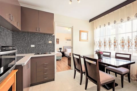 Comfort Two-bedroom Family Suite | Private kitchenette | Microwave, coffee/tea maker, electric kettle, toaster