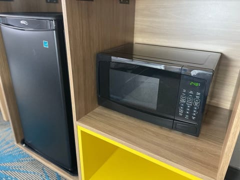 Desk, laptop workspace, blackout drapes, iron/ironing board