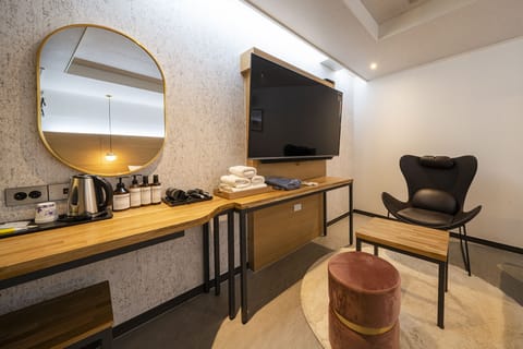 Premium Double Room | Living area | Flat-screen TV, heated floors