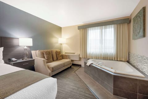 Suite, 1 King Bed, Non Smoking, Jetted Tub | Premium bedding, in-room safe, individually decorated