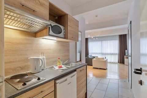 Apartment, 1 Bedroom | Private kitchen | Fridge, microwave, stovetop, coffee/tea maker