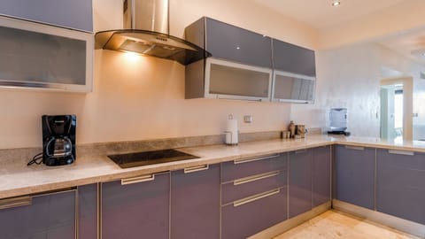 Deluxe Apartment, 2 Bedrooms | Private kitchen | Full-size fridge, microwave, stovetop, coffee/tea maker