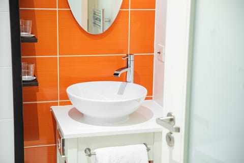 Shower, rainfall showerhead, designer toiletries, hair dryer