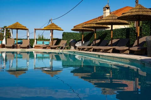 Outdoor pool, open 8:00 AM to 9:00 PM, pool umbrellas, sun loungers