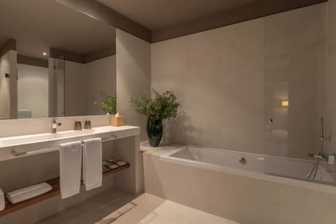 Junior Suite (Gallery) | Bathroom | Deep soaking tub, rainfall showerhead, designer toiletries, hair dryer