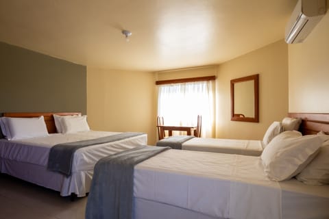 Deluxe Quadruple Room, Private Bathroom, Garden View | Hypo-allergenic bedding, minibar, in-room safe, laptop workspace