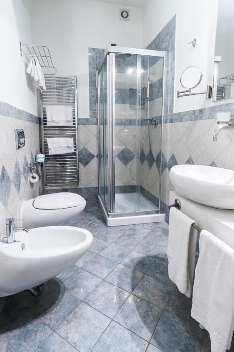 Shower, rainfall showerhead, designer toiletries, hair dryer