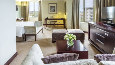 Junior Suite, 1 Queen Bed, City View | Premium bedding, minibar, in-room safe, desk