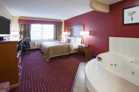 Suite, 1 King Bed (Hot tub) | In-room safe, desk, laptop workspace, blackout drapes