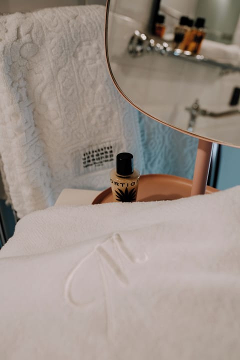 Hair dryer, bathrobes, bidet, towels