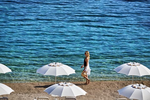 On the beach, sun loungers, beach umbrellas, beach towels