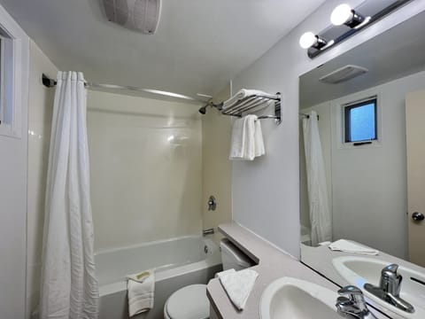 Room, 2 Queen Beds | Bathroom | Combined shower/tub, free toiletries, hair dryer, towels